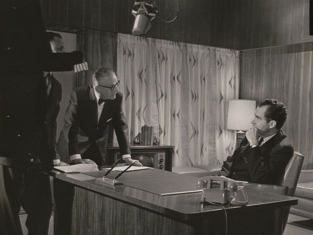 Future President Richard Nixon listens to Ray Culley