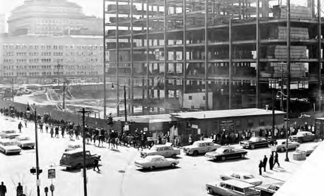 Demonstrators marching in front of Federal Building