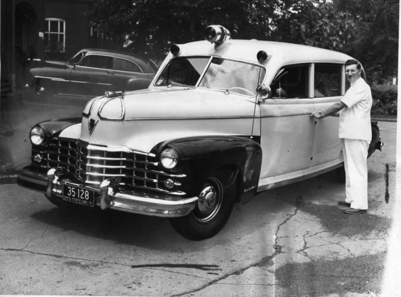 Head Aide Leslie Mugford Poses With New Hospital Ambulance