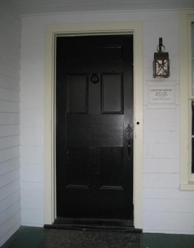 Front door and century home plaque.