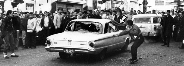 Protestor Attacks Car